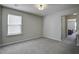 Bright bedroom with window and carpet flooring at 415 Snowy Plover Ln, Summerville, SC 29486