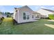 Tan house exterior with a large window and small backyard at 510 Eastern Isle Ave, Summerville, SC 29486