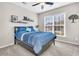 Guest bedroom with a blue comforter and window overlooking the street at 510 Eastern Isle Ave, Summerville, SC 29486