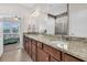 Double vanity bathroom with granite countertops and large mirror at 510 Eastern Isle Ave, Summerville, SC 29486