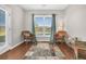 Cozy sitting area with wicker chairs, a window seat, and view of the backyard at 510 Eastern Isle Ave, Summerville, SC 29486