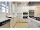 White kitchen with stainless steel appliances and quartz countertops at 510 Eastern Isle Ave, Summerville, SC 29486
