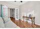 Sunlit office with hardwood floors, French doors, and a built-in desk area at 510 Eastern Isle Ave, Summerville, SC 29486