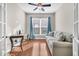 Bright office space with hardwood floors, built-in desk, and comfortable sofa at 510 Eastern Isle Ave, Summerville, SC 29486