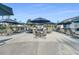 Outdoor patio area with multiple tables and umbrellas at 510 Eastern Isle Ave, Summerville, SC 29486