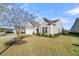Tan house with white garage door and manicured lawn at 510 Eastern Isle Ave, Summerville, SC 29486