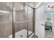 Walk-in shower with glass doors and neutral tile at 510 Eastern Isle Ave, Summerville, SC 29486