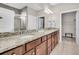 Double vanity bathroom with granite countertops and a walk-in shower at 510 Eastern Isle Ave, Summerville, SC 29486