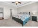 Bedroom with a floral comforter, ceiling fan, and access to the bathroom and laundry at 510 Eastern Isle Ave, Summerville, SC 29486
