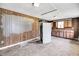 Small outdated kitchen needing renovation, featuring wood paneling and old appliances at 1860/1858 Taberwood Cir, Charleston, SC 29407
