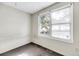 Small bedroom with worn carpet, showing some wall damage and a window with blinds at 1860/1858 Taberwood Cir, Charleston, SC 29407