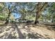 Yellow house with driveway and mature trees at 1860/1858 Taberwood Cir, Charleston, SC 29407