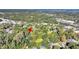 Aerial view of the house nestled in a tree-lined neighborhood near a river at 1860/1858 Taberwood Cir, Charleston, SC 29407