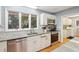 Bright kitchen boasts granite countertops and stainless steel appliances at 2588 High Hammock Rd, Johns Island, SC 29455