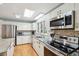 Modern kitchen with stainless steel appliances and granite countertops at 2588 High Hammock Rd, Johns Island, SC 29455