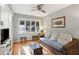 Relaxing living room with wicker sofa, coffee table, and hardwood floors at 2588 High Hammock Rd, Johns Island, SC 29455
