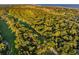 Aerial view of golf course and homes surrounded by trees at 2588 High Hammock Rd, Johns Island, SC 29455