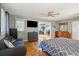Large main bedroom with a king-size bed, hardwood floors and access to the deck at 2588 High Hammock Rd, Johns Island, SC 29455