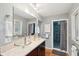 Elegant bathroom with double vanity, glass sinks, and a walk-in shower at 2588 High Hammock Rd, Johns Island, SC 29455