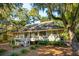 Single-story home with a spacious deck and landscaped yard at 2588 High Hammock Rd, Johns Island, SC 29455