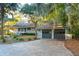 House exterior with a two-car garage and walkway at 2588 High Hammock Rd, Johns Island, SC 29455