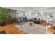 Comfortable living room with hardwood floors and a sliding barn door at 2588 High Hammock Rd, Johns Island, SC 29455