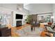 Spacious living area with a fireplace, hardwood floors, and large windows at 2588 High Hammock Rd, Johns Island, SC 29455