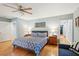 Spacious bedroom with hardwood floors, large bed, and ceiling fan at 2588 High Hammock Rd, Johns Island, SC 29455