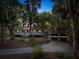 House exterior showcasing a two-car garage and well-lit driveway at 2588 High Hammock Rd, Johns Island, SC 29455
