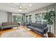 Open living space with hardwood floors, comfortable seating and access to a deck at 2588 High Hammock Rd, Johns Island, SC 29455