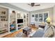 Cozy living room with built-in shelving, comfortable seating, and hardwood floors at 2588 High Hammock Rd, Johns Island, SC 29455