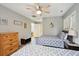 Bedroom with queen bed, dresser, and ceiling fan at 2588 High Hammock Rd, Johns Island, SC 29455