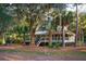 Southern style home nestled in lush landscaping with mature trees and Spanish moss at 2588 High Hammock Rd, Johns Island, SC 29455