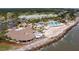 Aerial view of resort-style amenities including a clubhouse, pool, and beach access at 2588 High Hammock Rd, Johns Island, SC 29455