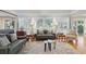 Relaxing living room with leather sofas and wood flooring at 2588 High Hammock Rd, Johns Island, SC 29455