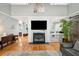 Spacious living room with a fireplace and built-in shelving at 2588 High Hammock Rd, Johns Island, SC 29455