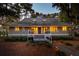 House exterior at dusk, featuring a gray facade and porch at 2588 High Hammock Rd, Johns Island, SC 29455