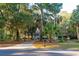 House exterior nestled in a lush, tree-filled landscape at 2588 High Hammock Rd, Johns Island, SC 29455