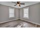 Spacious bedroom with ceiling fan and two windows at 2674 Houston St, North Charleston, SC 29405