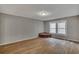 Living room with wood-look floors and a brick corner feature at 2674 Houston St, North Charleston, SC 29405