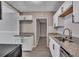 Updated kitchen with white cabinets and granite countertops at 2674 Houston St, North Charleston, SC 29405