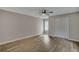Charming bedroom with hardwood floors, a ceiling fan, and a window at 2674 Houston St, North Charleston, SC 29405