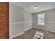 Bright bedroom with wood-look floors and neutral walls at 2674 Houston St, North Charleston, SC 29405