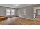 Bright living room featuring hardwood floors and a brick fireplace at 2674 Houston St, North Charleston, SC 29405