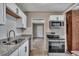 Modern kitchen with stainless steel appliances and granite countertops at 2674 Houston St, North Charleston, SC 29405
