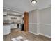 Open dining area with wood-look floors and brick accent wall at 2674 Houston St, North Charleston, SC 29405