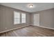 Bright bedroom with gray walls, wood floors, and window at 2674 Houston St, North Charleston, SC 29405
