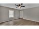 Spacious bedroom with hardwood floors, a window, and an adjacent door at 2674 Houston St, North Charleston, SC 29405