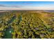 Aerial view showcasing a golf course community with ocean views and lush greenery at 2588 High Hammock Rd, Johns Island, SC 29455