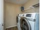 Bright laundry room, featuring washer and dryer and ample shelving at 4966 Ballantine Drive, Summerville, SC 29485